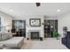 Living room with fireplace, built-in display cabinets, and neutral decor at 3430 Burlingame Blvd, Westfield, IN 46074