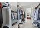 Walk-in closet with a mirror, shelving, hanging racks and a door to the main bedroom at 3430 Burlingame Blvd, Westfield, IN 46074