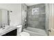 Modern bathroom with tiled shower/tub, stylish vanity, and contemporary fixtures at 3511 N Keystone Ave, Indianapolis, IN 46218