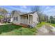Single-story home with inviting porch and landscaped yard, perfect for relaxing outdoors at 3511 N Keystone Ave, Indianapolis, IN 46218