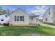 Attractive single-story home featuring blue shutters and an inviting covered front porch at 3511 N Keystone Ave, Indianapolis, IN 46218