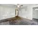 Bright living room with neutral carpet and ceiling fan, perfect for relaxation and entertainment at 3511 N Keystone Ave, Indianapolis, IN 46218