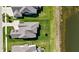 Aerial view of a beautiful home with a well-maintained yard and a nearby pond at 3678 Sugar Pine Ln, Zionsville, IN 46077