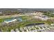 Aerial view of development featuring homes, schools, shopping, and ponds gives a sense of community, convenience, and natural beauty at 3678 Sugar Pine Ln, Zionsville, IN 46077