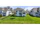 Well-maintained backyard with a lush lawn and a view of the home's rear exterior at 3678 Sugar Pine Ln, Zionsville, IN 46077