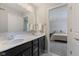 Bathroom featuring double sink vanity and chrome fixtures, with a bedroom view, creates an open, airy feel at 3678 Sugar Pine Ln, Zionsville, IN 46077