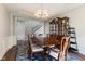 Elegant dining room with a formal dining table, chandelier, and a china cabinet at 3678 Sugar Pine Ln, Zionsville, IN 46077