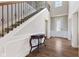 Elegant foyer featuring hardwood floors, staircase with wrought iron spindles, and a decorative table at 3678 Sugar Pine Ln, Zionsville, IN 46077