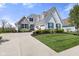 Stunning home with stone accents, blue shutters, and well-maintained landscaping at 3678 Sugar Pine Ln, Zionsville, IN 46077