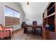 Spacious office with hardwood floors, built-in shelving, a large desk, and a window with a view at 3678 Sugar Pine Ln, Zionsville, IN 46077