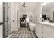Charming bathroom featuring a soaking tub, a furniture-style vanity, and a separate glass shower enclosure at 440 E 82Nd St, Indianapolis, IN 46240