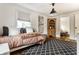 Comfortable bedroom offering hardwood floors, a graphic area rug, a closet and plenty of natural light at 440 E 82Nd St, Indianapolis, IN 46240
