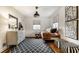 Bright bedroom showcasing neutral walls, hardwood floors, an area rug, and comfortable furnishings at 440 E 82Nd St, Indianapolis, IN 46240