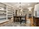 Formal dining room with wood floors, large windows, lighting, and built-ins at 440 E 82Nd St, Indianapolis, IN 46240