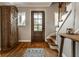 Inviting foyer featuring hardwood floors and a staircase at 440 E 82Nd St, Indianapolis, IN 46240