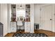 Bright home office showcasing a built-in desk and shelving, hardwood floors, and neutral colors at 440 E 82Nd St, Indianapolis, IN 46240