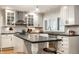 Lovely kitchen with ample counter space, shaker cabinets, and pendant lighting at 440 E 82Nd St, Indianapolis, IN 46240