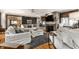 Spacious living room with stone fireplace, built-in shelves, and natural light at 440 E 82Nd St, Indianapolis, IN 46240