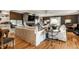 Bright living room with hardwood floors, stone fireplace, and built-in shelving at 440 E 82Nd St, Indianapolis, IN 46240