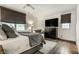 Comfortable main bedroom featuring hardwood floors, lots of natural light, and neutral decor at 440 E 82Nd St, Indianapolis, IN 46240