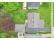 Aerial view of a private backyard featuring a patio, lush lawn, and mature trees at 473 N 17Th St, Noblesville, IN 46060