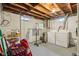 Unfinished basement area with washer and dryer hookups, providing convenience for laundry at 473 N 17Th St, Noblesville, IN 46060