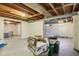 Partially finished basement area with exposed wood ceiling, offering potential for customization at 473 N 17Th St, Noblesville, IN 46060
