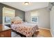 Bedroom featuring hardwood floors and natural light from the two windows at 473 N 17Th St, Noblesville, IN 46060