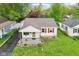 Charming home featuring red shutters, a cozy front porch, and a manicured lawn at 473 N 17Th St, Noblesville, IN 46060