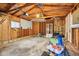 Unfinished garage with a full view of rafters and wooden support beams perfect for various projects at 473 N 17Th St, Noblesville, IN 46060
