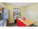 View of kitchen island, cabinetry, stainless steel refrigerator, and backyard view at 473 N 17Th St, Noblesville, IN 46060