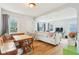 Open-concept living and dining area with hardwood floors, creating a seamless flow for entertaining and everyday living at 473 N 17Th St, Noblesville, IN 46060