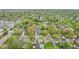 Aerial scene of neighborhood with mature trees lining streets and residential homes at 473 N 17Th St, Noblesville, IN 46060