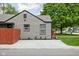 Charming home exterior featuring a gravel driveway, tidy landscaping, and a well-maintained lawn at 4902 Kingsley Dr, Indianapolis, IN 46205