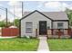 Charming single-story home featuring fresh landscaping, sidewalk lighting, and a welcoming front porch at 4902 Kingsley Dr, Indianapolis, IN 46205