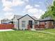 Charming single-story home with a landscaped front yard and inviting front porch at 4902 Kingsley Dr, Indianapolis, IN 46205