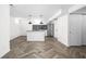 Open floor plan kitchen with large island, pendant lights, and stainless steel appliances at 4902 Kingsley Dr, Indianapolis, IN 46205