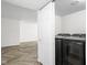 Laundry room showing new washer and dryer and tile flooring at 4902 Kingsley Dr, Indianapolis, IN 46205