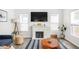 Bright living room with fireplace, large TV, and stylish decor throughout at 4902 Kingsley Dr, Indianapolis, IN 46205