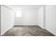 Room showcases light herringbone flooring and neutral paint at 4902 Kingsley Dr, Indianapolis, IN 46205