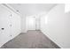 Spacious room with new carpeting, white walls, and white doors at 4902 Kingsley Dr, Indianapolis, IN 46205