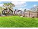 Large backyard with green lawn and privacy fence at 4917 N Park Ave, Indianapolis, IN 46205