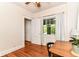 Bright bedroom with hardwood floors, a large window, and a ceiling fan at 4917 N Park Ave, Indianapolis, IN 46205