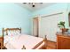 Charming bedroom features hardwood floors, closet, and a tranquil, pastel-colored decor at 4917 N Park Ave, Indianapolis, IN 46205