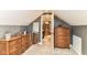 Bedroom with cozy carpet, stylish furniture, and a view to the bathroom and shower at 4917 N Park Ave, Indianapolis, IN 46205