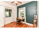 Comfortable bedroom with a ceiling fan, large windows, and nice hardwood floors at 4917 N Park Ave, Indianapolis, IN 46205