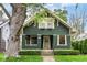 Charming two-story home with a well-maintained lawn and professional landscaping at 4917 N Park Ave, Indianapolis, IN 46205