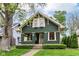 Charming two-story home with a well-maintained lawn and professional landscaping at 4917 N Park Ave, Indianapolis, IN 46205