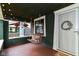 Inviting front porch with a swing, wreath and ambient lighting at 4917 N Park Ave, Indianapolis, IN 46205