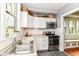 Updated kitchen with stainless steel appliances, granite countertops, and plenty of storage at 4917 N Park Ave, Indianapolis, IN 46205
